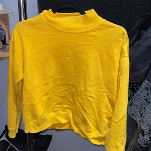 Yellow turtleneck sweatshirt